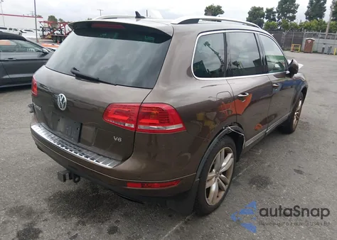 2014 Volkswagen Touareg 3.6L Executive z USA, uszkodzony, nr VIN WVGEF9BP7ED005811